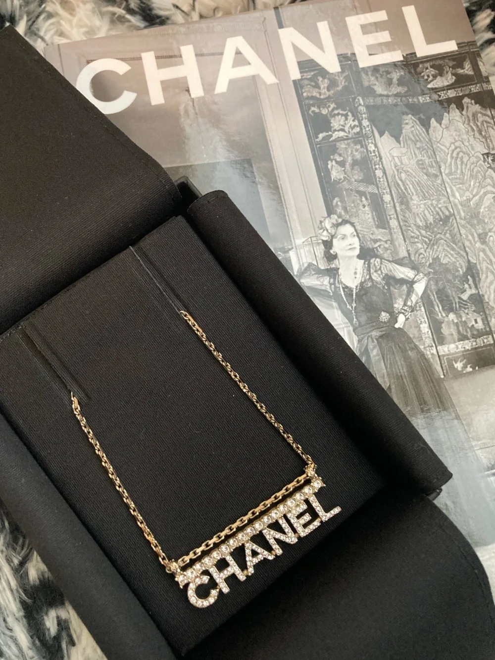 CHANEL Gold and Clear Crystal Logo Necklace